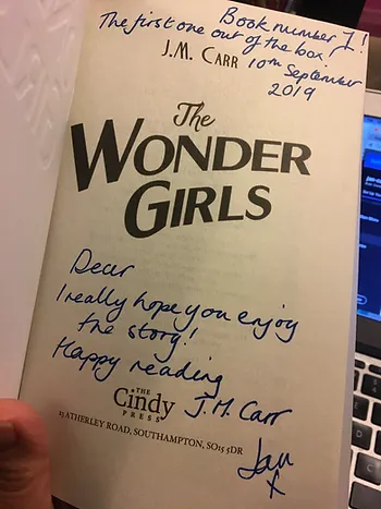 The Wonder Girls' title page with 'first one out of the box' inscription