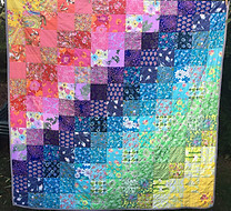 a rainbow patchwork quilt