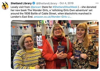picture of the author with two librarians at The Shetland library